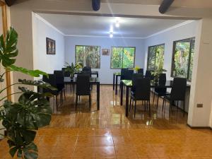a dining room with a table and chairs at Pumakari Rapa Nui in Hanga Roa