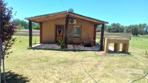 a small house in the middle of a field at Soñada San Rafael in San Rafael