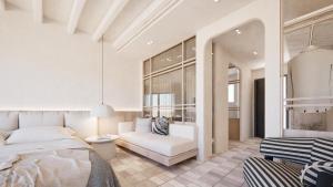 a bedroom with a bed and a couch at Pefkos Blue in Pefki +91 photos