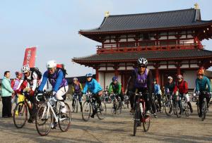 a group of people riding bikes in front of a building at Guesthouse Naramachi in Nara