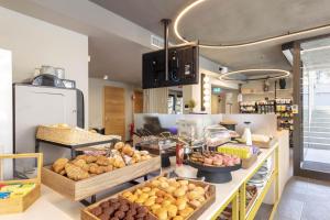 a bakery with lots of different types of bread at B&B Hotel Genova City Center in Genoa