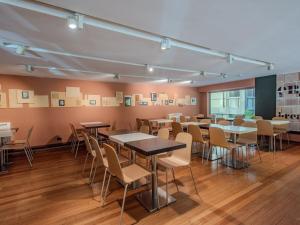 a dining room with tables and chairs at B&B Hotel Firenze City Center in Florence +34 photos