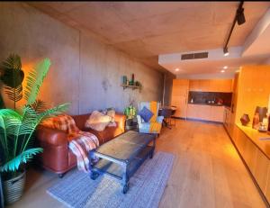 a living room with a couch and a table at Bliss in Braddon in Braddon