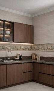 a kitchen with wooden cabinets and a sink at Evermond Suites in Alexandria