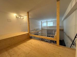an empty room with a cage on the wall at Loft bridge in Ascoli Piceno