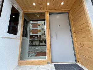 an entrance to a building with a white door at Loft bridge in Ascoli Piceno