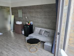 a living room with a couch and a chair at OCEAN DREAM-Beach House in Phú Quốc