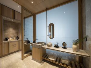 a bathroom with a sink and a mirror at İnemare Hotel in İğneada +108 photos