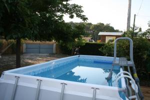 a swimming pool in a yard with a pool at Maison Claouey in Lège-Cap-Ferret