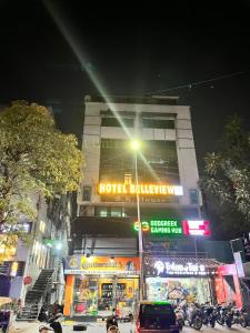a hotel building with a street light in front of it at Hotel Belleview VASTRAPUR in Jāmb