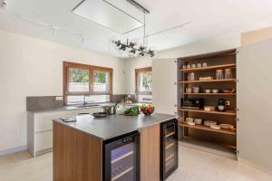 a kitchen with a large island in the middle at A paradise with ocean views in Conil de la Frontera
