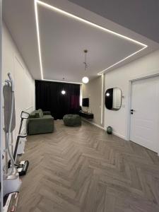 a large living room with a couch and a tv at Apartament 2 camere Fial in Bacău