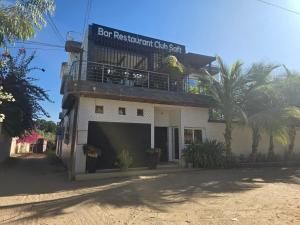 a building with a balcony on top of it at Club saft saly niakhal niakhal in Mbour