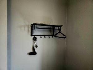 a shelf on a wall with a spoon at Cog Lane House in Burnley