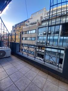 a view of a building from a balcony at Osiris Plaza in Buenos Aires