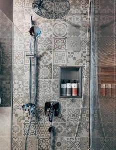 a bathroom with a shower with a glass door at "Quality Hosts Arlberg" Hotel Lux Alpinae in Sankt Anton am Arlberg +84 photos