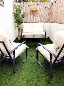 two chairs and a couch on a patio at אמדר בעתיקה in Beer Sheva