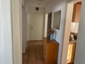 a hallway with a wooden dresser in a room at Ferienwohnung Bärbel in Freyung