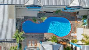 an overhead view of a swimming pool at a hotel at Cheap Hotel Room in Sosua Center in Sosúa