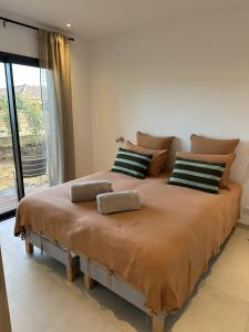 a large bed in a room with a large window at Villas Vangarone in Lecci +43 photos