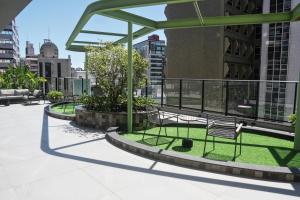 a group of chairs sitting on top of a building at Xtay Oslo Florianópolis - Residential studio 5 minutes from downtown, close to Epic School and Atlantis Executive Center in Florianópolis