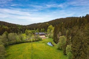 an aerial view of a house in the middle of a field at Körnermühle in Dippoldiswalde