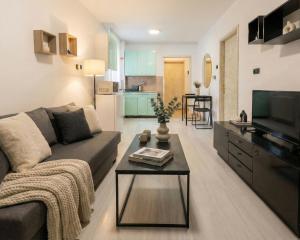a living room with a couch and a table at BGD Downtown Hostel in Belgrade