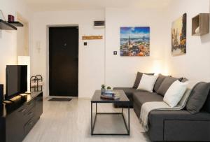 a living room with a couch and a table at BGD Downtown Hostel in Belgrade