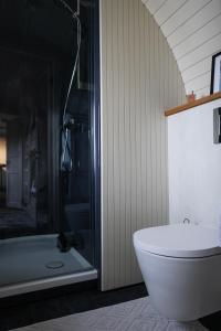 a bathroom with a tub and a toilet and a shower at Iglupark in Tallinn +28 photos