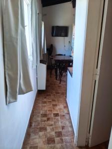 a hallway with a kitchen and a table in a room at Bruna de Mar in Mar de Ajó