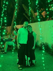 a man and woman posing for a picture at night at Coco Bliss - Ahangama in Ahangama