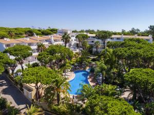 an aerial view of a resort with a pool and trees at Ria Park Garden Hotel in Vale do Lobo