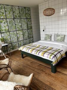 a bedroom with a bed in a room at Bird Deventer in Deventer