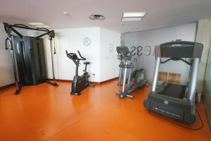 a gym with several exercise bikes in a room at Port Azafata Valencia in Manises