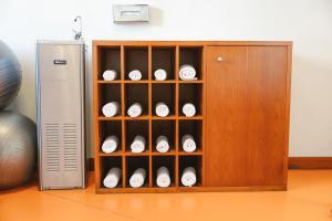 a cabinet filled with white baseballs in it at Port Azafata Valencia in Manises +64 photos