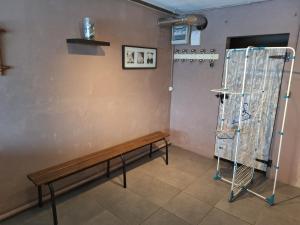 a room with a bench and a metal rack at Gîte du Craon de Ludes in Ludes +27 photos