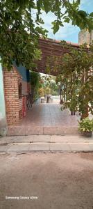 a brick walkway with a pavilion in a building at Casa duplex para lazer in Paulista