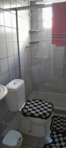 a bathroom with a shower with a toilet and a sink at Casa duplex para lazer in Paulista +4 photos