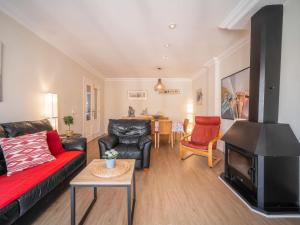 a living room with a couch and a fireplace at Apartment Mariners 4 by Interhome in Alcudia