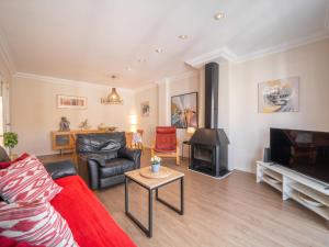 a living room with a couch and a stove at Apartment Mariners 4 by Interhome in Alcudia