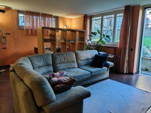 a living room with a couch and a table at Appartamento Sleep&Fly in Grassobbio