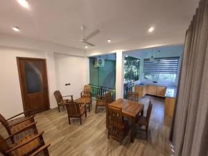 a dining room and kitchen with a table and chairs at Highgarden Hideaway Villa - Gampola in Gampola +37 photos