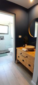 a bathroom with a sink and a mirror and a tub at Cantal Bed & Breakfast in El Durazno +15 photos