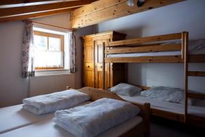 a bedroom with two bunk beds and a window at Hecherhaus in Schwaz +41 photos