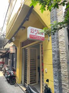 a store with a sign on the front of a building at D Home in Ho Chi Minh City