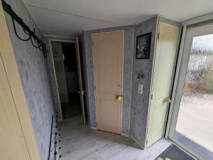 an empty room with a door and a window at Beach Resort Kamperland - 1747 in Kamperland +16 photos