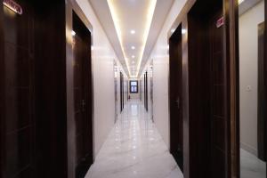 a hallway of a building with a hallwayngth at Old RAO Hotel Kotwan in Kosi