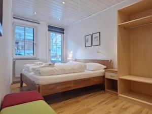 a bedroom with a bed in a room at Apartment Peacock - Steinbock Lodges in Zell am See