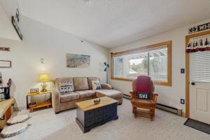 a living room with a couch and a chair at Fall Line W212 in Newry +21 photos