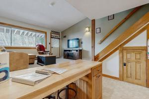 a home office with a desk and a living room at Fall Line W212 in Newry